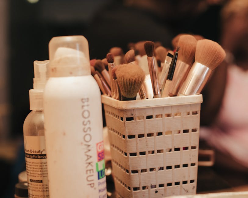 A collection of makeup brushes and beauty products neatly organized in a holder